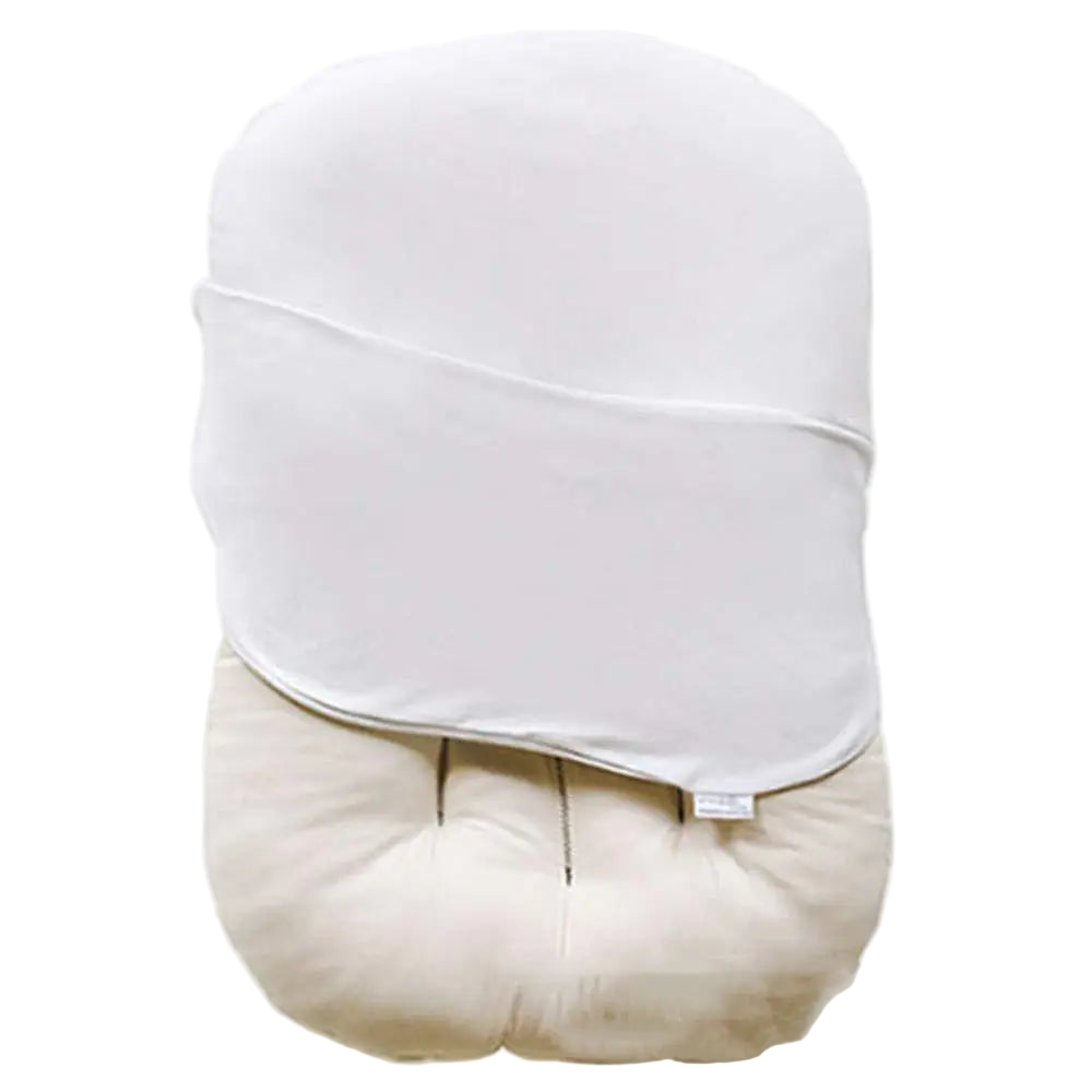 White shirt with a beige cushion on a white background