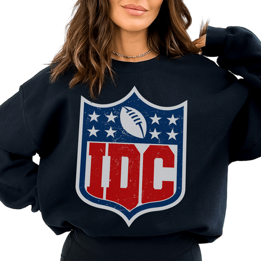 Person wearing a black sweatshirt with a red and blue logo on a white background