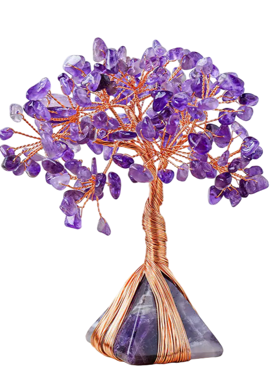 Purple crystal tree on a wooden surface with a white background