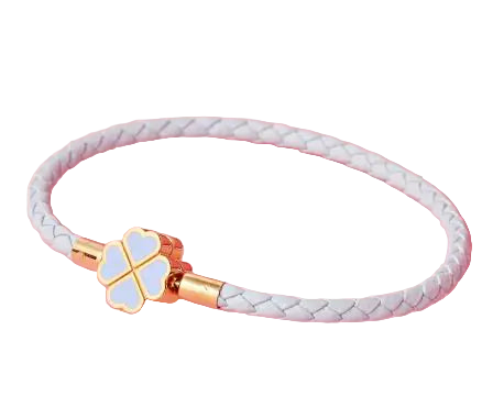 White braided bracelet with a gold and blue clover-shaped clasp on a pink background