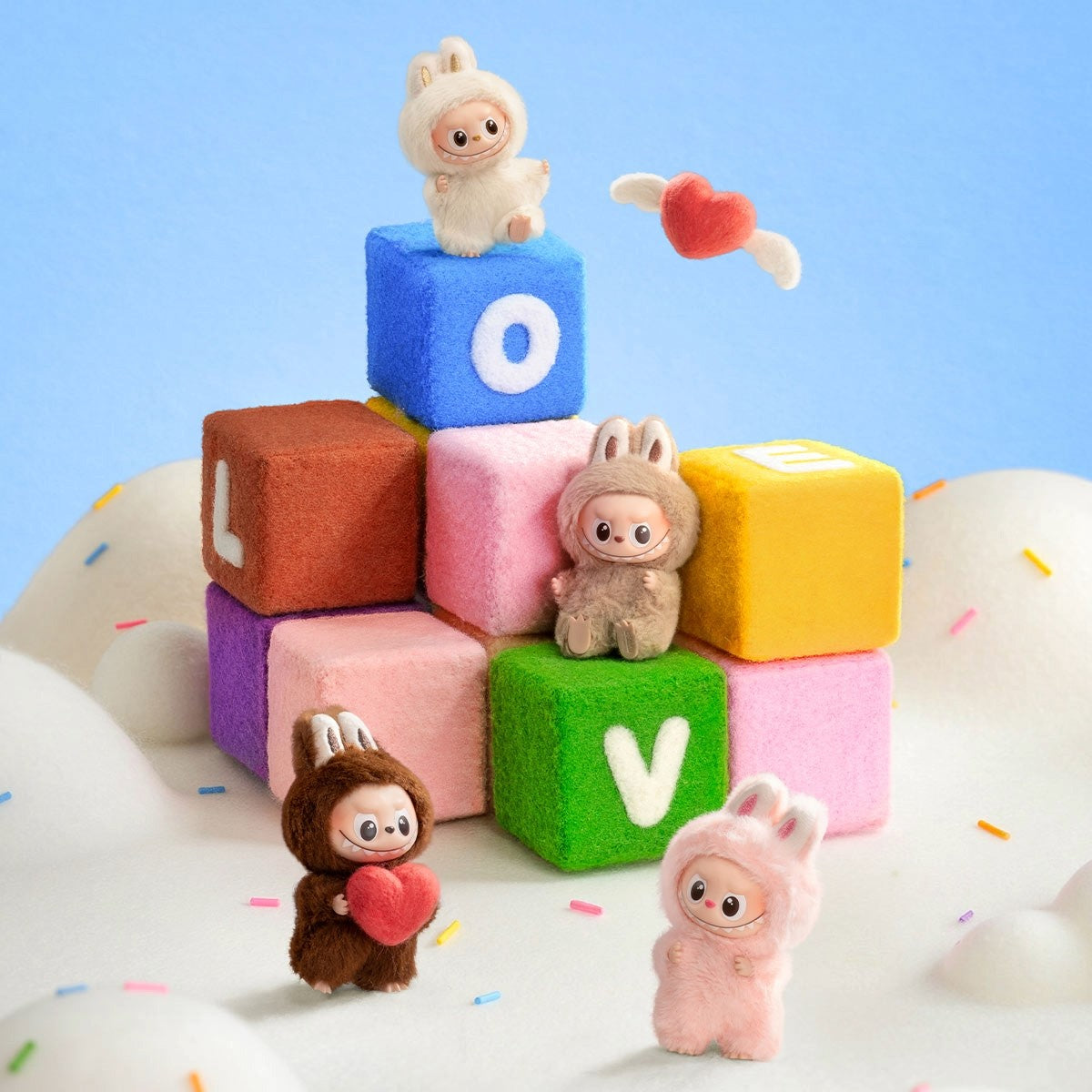 Colorful foam blocks with cartoon animal figures spelling 'LOVE' on a blue background