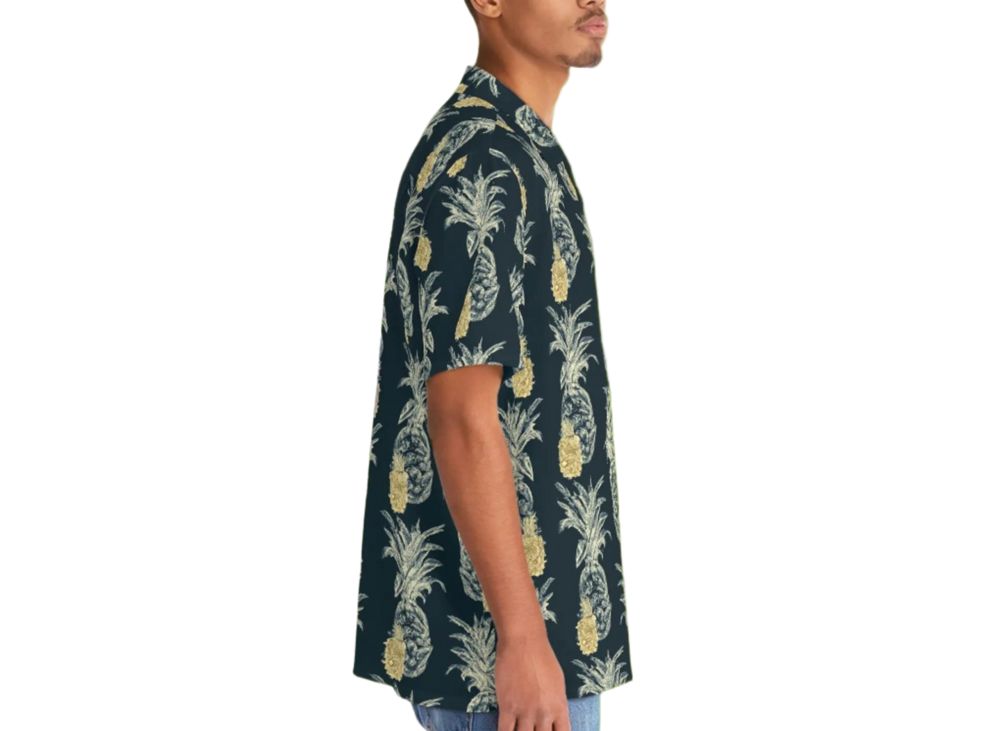 Man wearing a dark green Hawaiian shirt with pineapple pattern on a white background