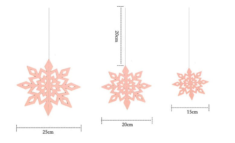 Three pink snowflake decorations with measurements on a white background