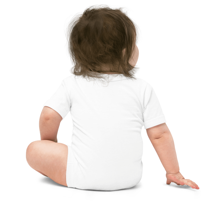 Baby in a white onesie sitting on a white background