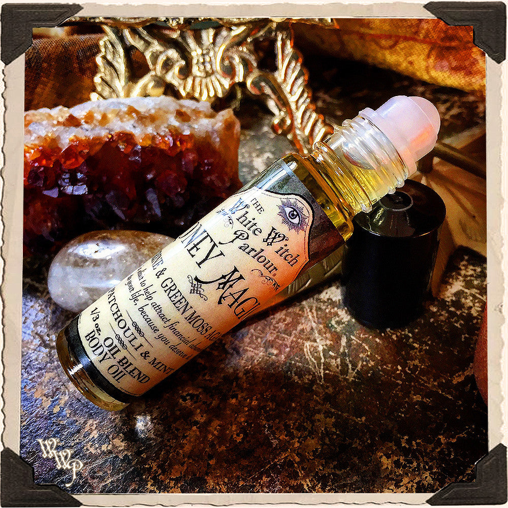Roll-on bottle of 'White Witch Parlor' with decorative elements on a textured surface