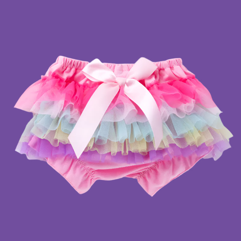 Colorful tutu skirt with a pink bow on a white background
