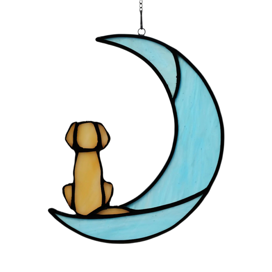 Decorative stained glass moon with a dog sitting on it, hanging against a white background.