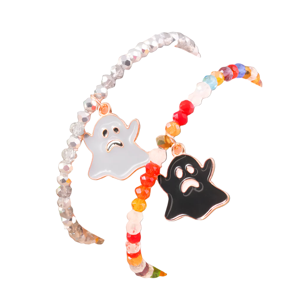 Colorful beaded bracelet with ghost charms on a wrist against a neutral background
