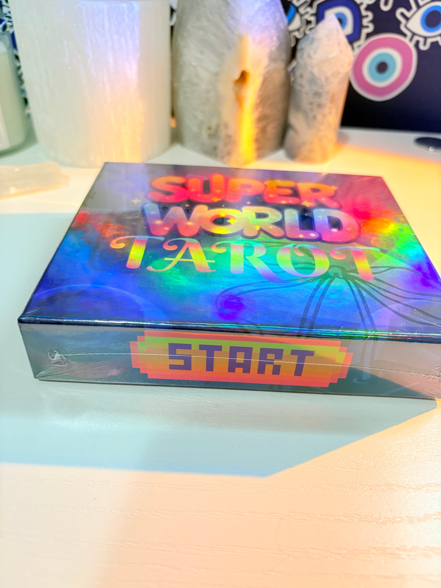 Colorful game box with 'Super World Atari' text on a blurred background
