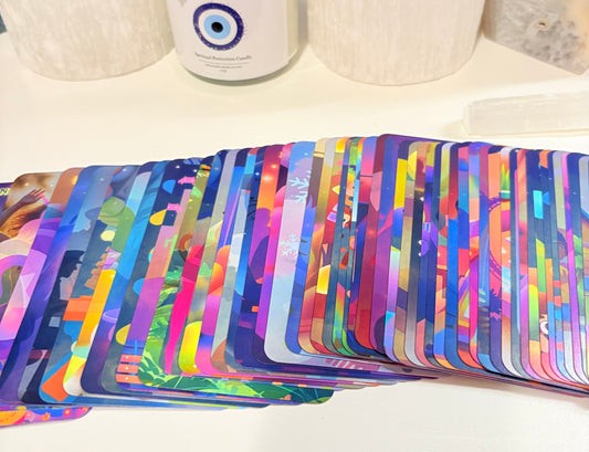 Colorful abstract patterned fabric draped over a chair with a white cushion.