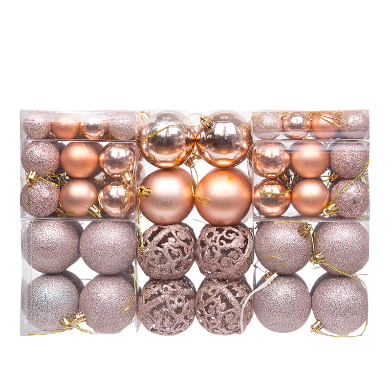 Assorted rose gold and silver Christmas ornaments in a clear box on a white background