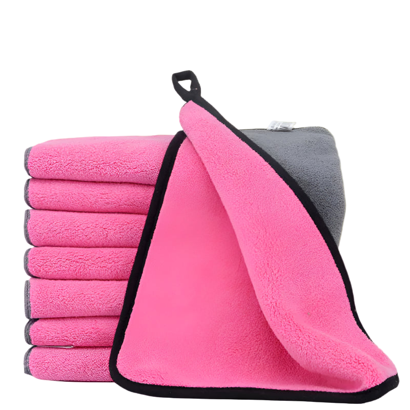 Stack of pink microfiber cloths with a gray one on a white background