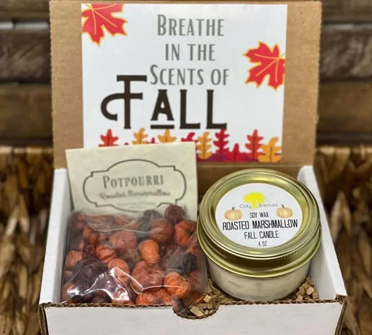 Gift set with candle and potpourri labeled 'Breathe in the Scents of Fall' on a wooden background.