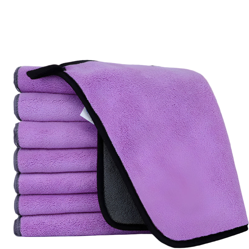 Set of purple microfiber cloths with black edges on a white background