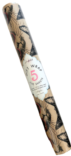 Three rolls of decorative gift wrap with floral patterns on a marble surface.