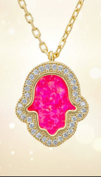 Necklace with a pink opal hamsa pendant on a white background