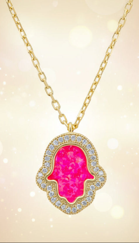 Necklace with a pink opal hamsa pendant on a white background