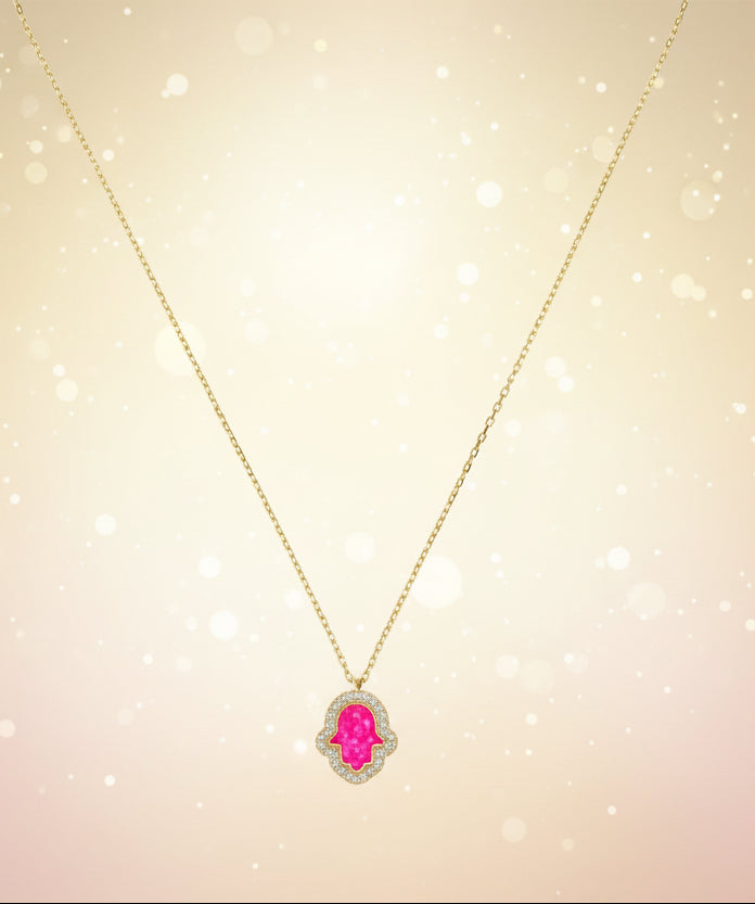 Necklace with a pink pendant on a white background