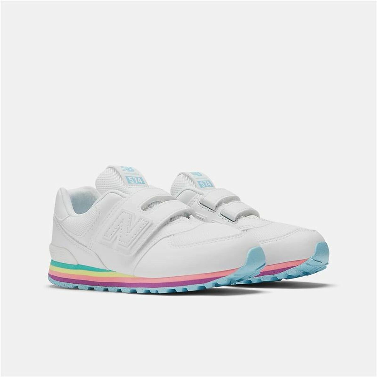 White sneakers with colorful sole on a light gray background