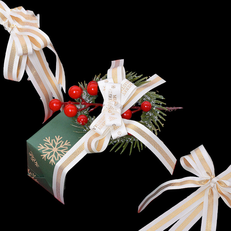 Decorative Christmas presents with ribbons and greenery on a red surface