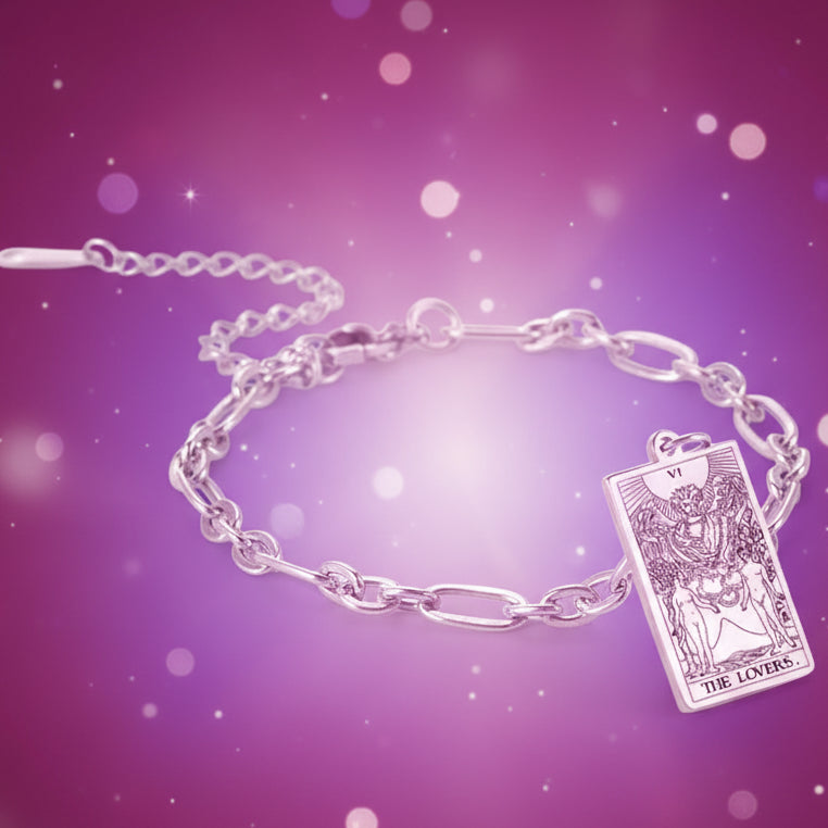 Silver bracelet with a tarot card charm on a white background