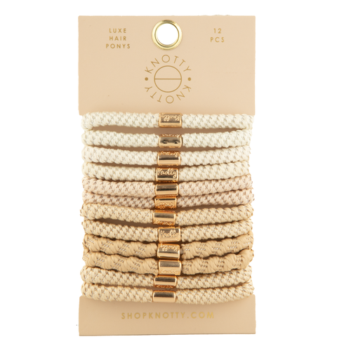 Pack of beige hair ties with gold ends on a beige card, featuring the brand 'Knotty'.