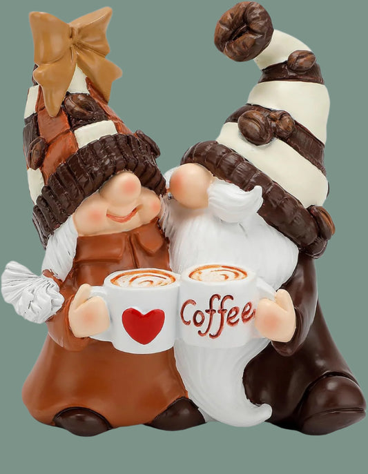 Two gnomes holding coffee mugs with a heart and 'Coffee' text, wearing winter hats.