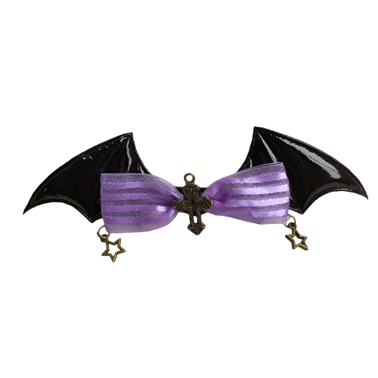 Bat-shaped hair clip with purple ribbon and decorative elements on a white background