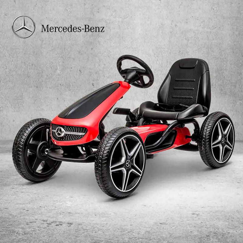 Red and black children's go-kart with Mercedes-Benz logo on a gray background