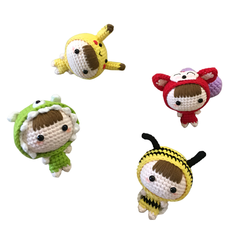 Four small crochet characters on a textured surface