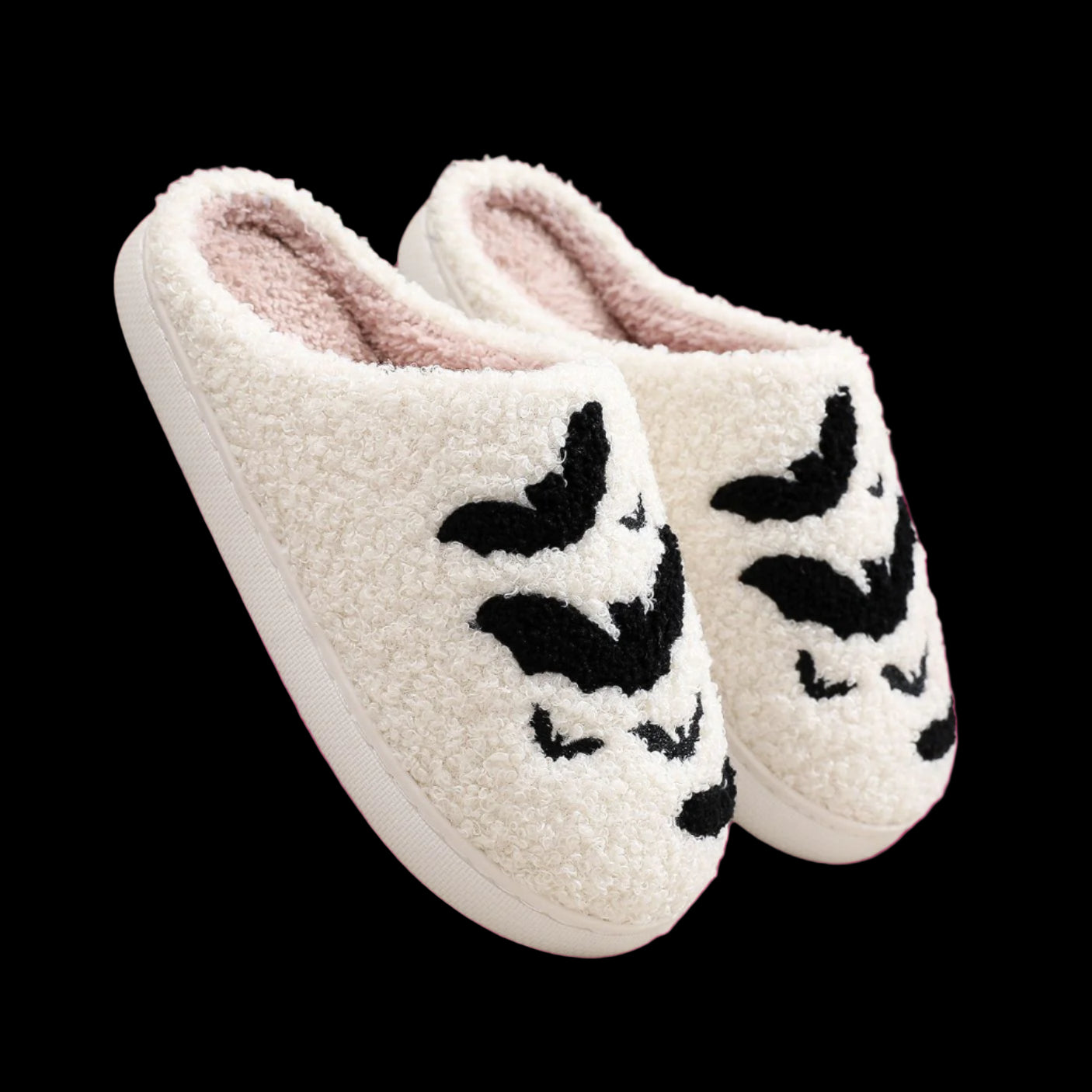 White slippers with black butterfly designs on a light background