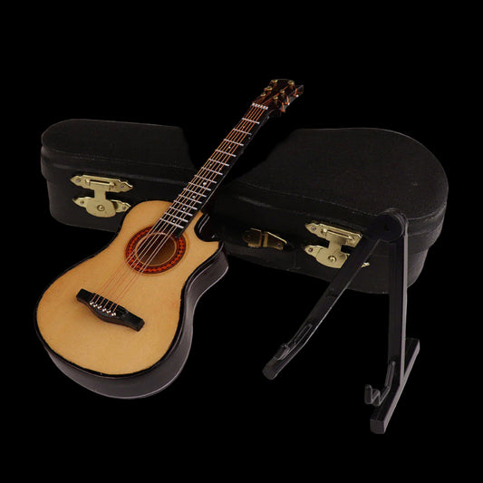 Small acoustic guitar with a black case and stand on a white background