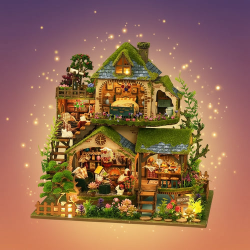 Detailed model of a cottage with various rooms and decorative elements on a white background