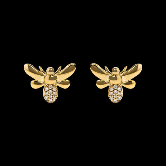 Gold bee-shaped earrings with embedded stones on a white background