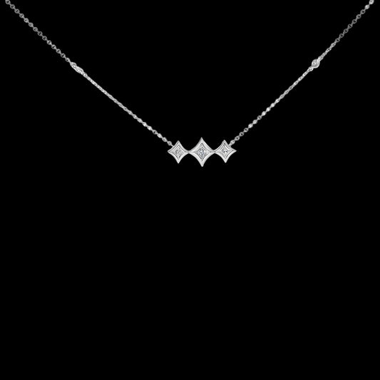 Diamond necklace with three star-shaped pendants on a white background