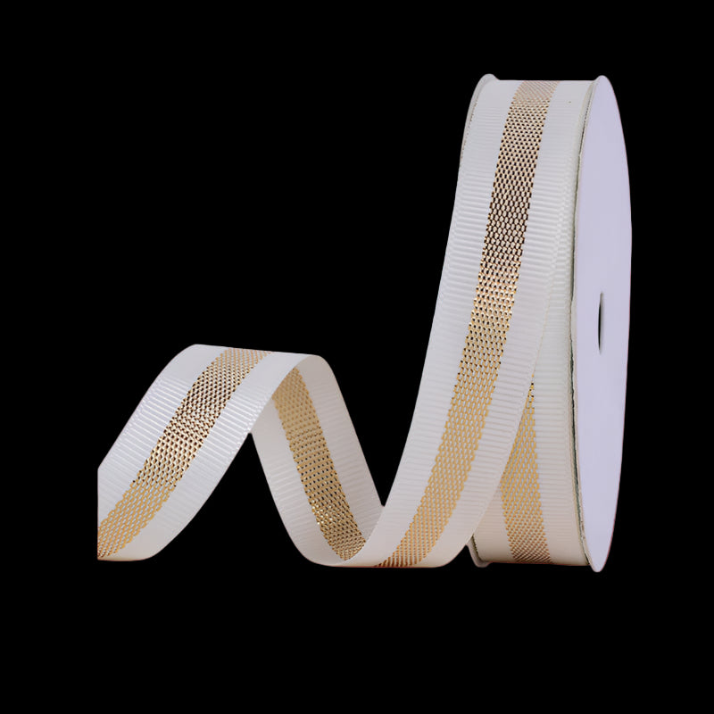 Roll of ribbon with gold and white pattern on a white background