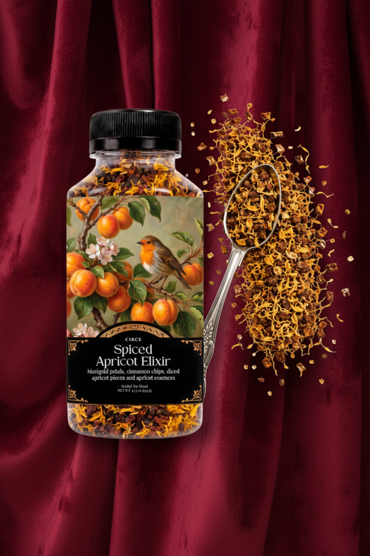 A bottle of Cider Spiced Apricot Elixir with a black cap and a label showing an apricot tree illustration, shown next to a spoonful of dried apricot pieces on a white background.