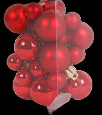 Clear plastic box filled with red Christmas ornaments on a white background