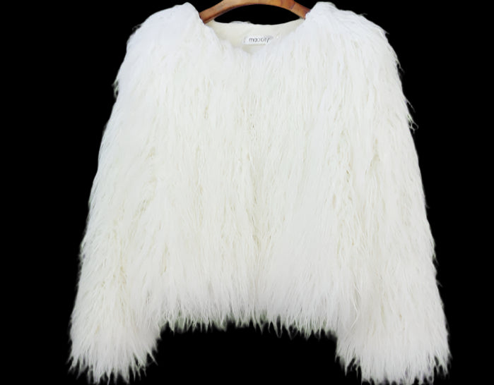 White fluffy jacket on a hanger against a plain background