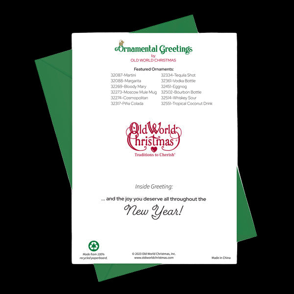 Christmas card with green envelope and Old World Christmas branding on a white background