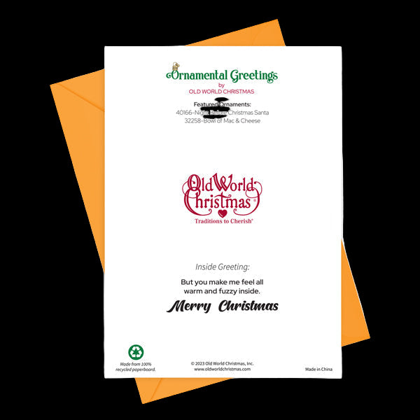 Christmas card with orange envelope and 'Old World Christmas' branding on a white background