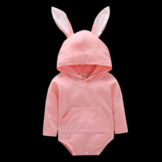 Pink baby onesie with bunny ears on a white background