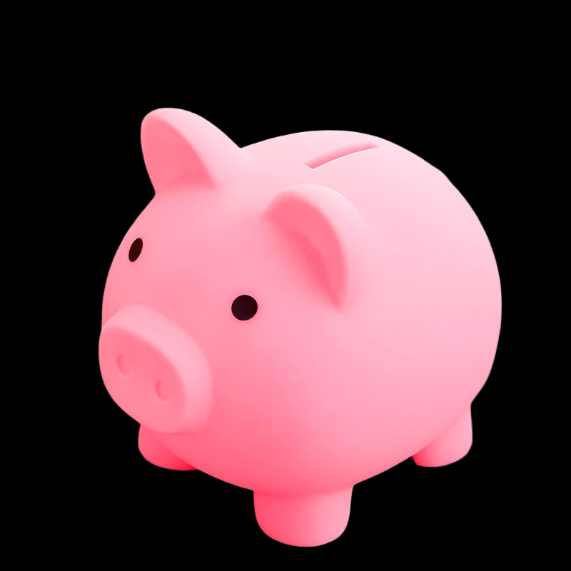 Pink piggy bank on a pink surface with a blurred background