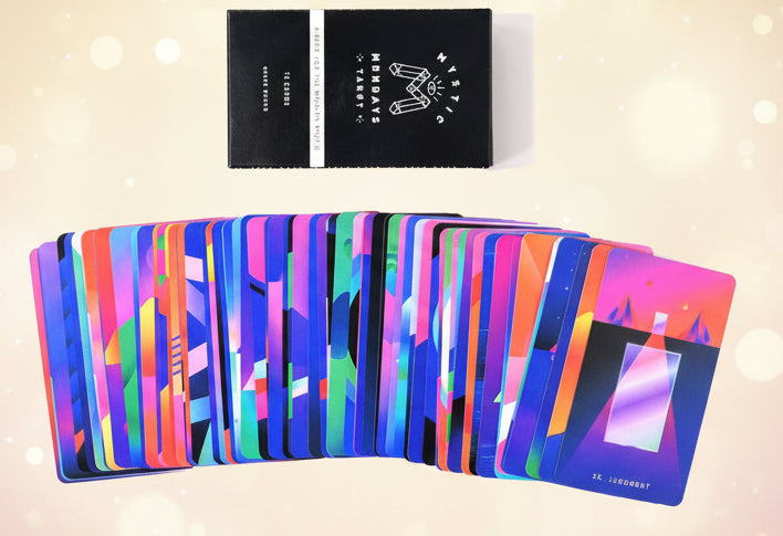 Colorful deck of cards with a black card holder on a white background