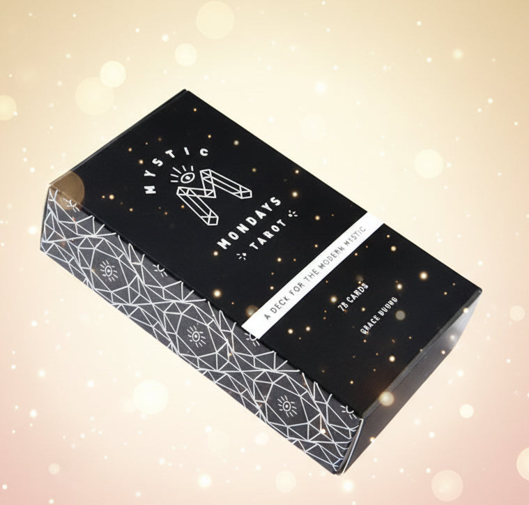 Black tarot card box with geometric patterns and 'Mystic Mondays Tarot' branding on a white background.