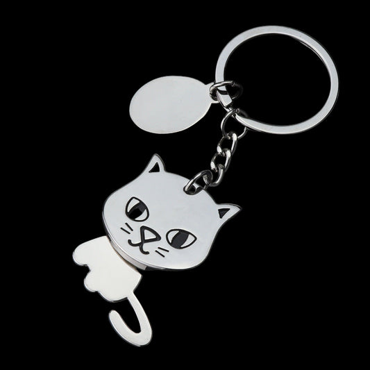 Cat-shaped keychain on a black background