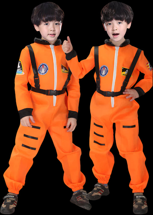 Two children wearing orange astronaut suits on a black background