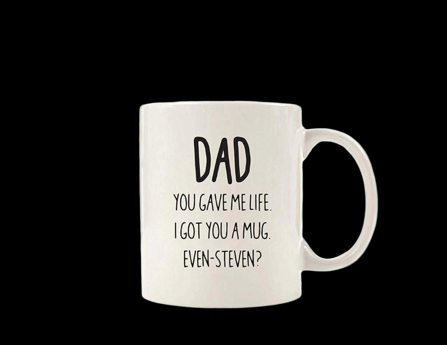 White mug with text on a wooden table in a kitchen setting