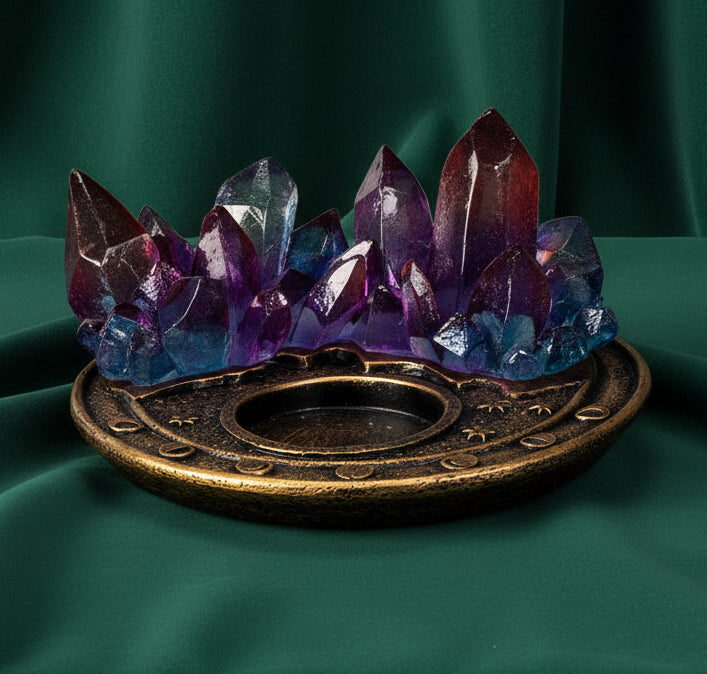 A decorative crystal cluster candle holder featuring translucent purple, blue, and red crystals rising from an ornate round bronze base, shown on a plain white background.