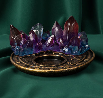A decorative crystal cluster candle holder featuring translucent purple, blue, and red crystals rising from an ornate round bronze base, shown on a plain white background.